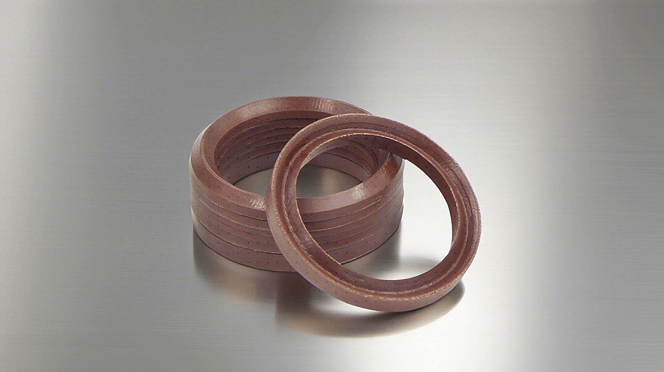 氟橡膠V型夾布油封---是由氟橡膠（FKM）+夾布密封材料制成的油封，主要應用于盾構機、冶金設備、陶瓷設備、重載油缸、油壓機等